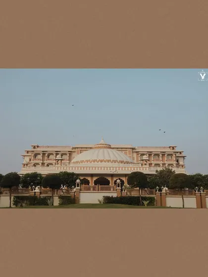 A wide shot of the magnificent Indana Palace in Jodhpur. This photo sets the scene for a grand destination wedding, showcasing the beauty of the chosen venue.