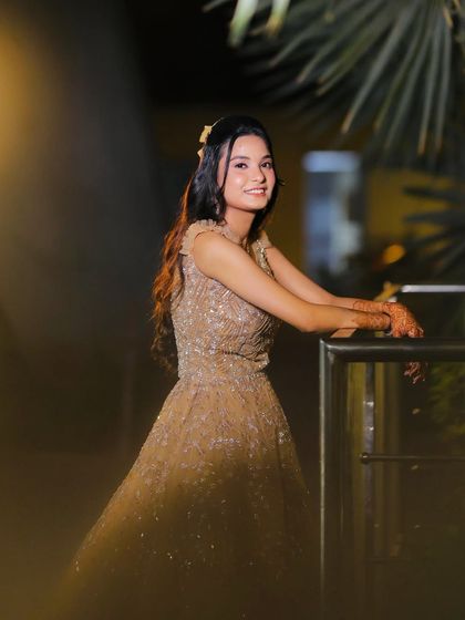 A close-up portrait, her smile lighting up the frame.