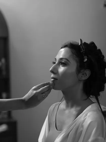 A black and white shot capturing the artistry. Even without color, you can see the flawless application and the way the makeup enhances her beautiful features.