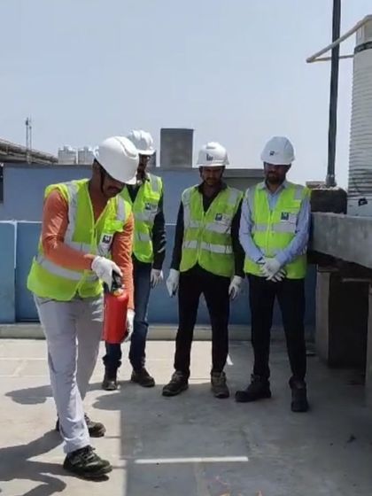 A technician practices using a fire extinguisher during a training drill. Hands-on practice ensures our teams are ready to respond effectively in the unlikely event of a fire.