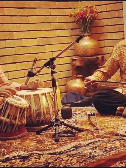 Rehearsing with Sarfaraaz Khan in a studio setting.