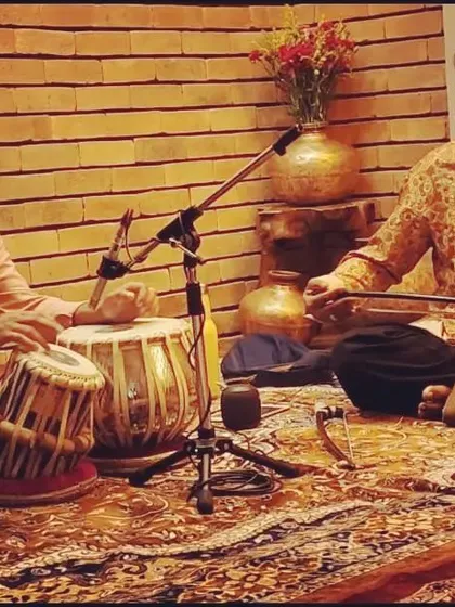 Rehearsing with Sarfaraaz Khan in a studio setting.