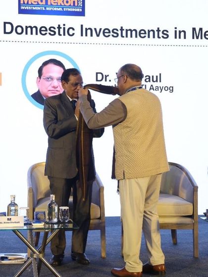 A moment of pride as our handcrafted stole is presented. Each stole from our Wullar Collection is handwoven, representing the skill and dedication of our artisan partners.