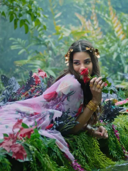 A floral fantasy for the Bhima campaign. The makeup is soft and romantic, with a floral crown and natural setting creating a beautiful, nature-inspired bridal look.