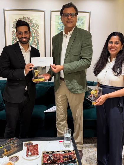 Presenting the trophy and prize money to members of our victorious badminton team. Success is always a collective effort.