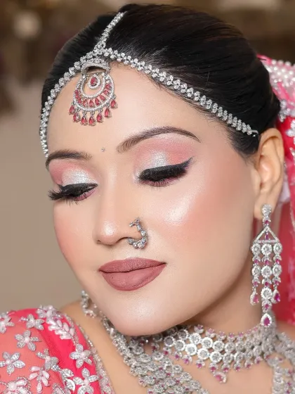 Another angle of the pink and silver look, showing the flawless application of the winged liner and false lashes.