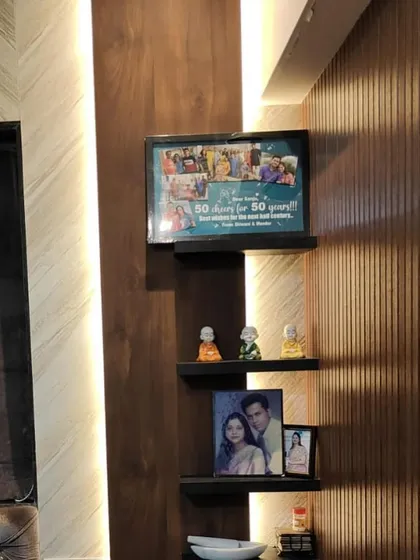 A client shared this photo of the custom 50th birthday frame displayed in their home. It looks perfect on their corner shelf.