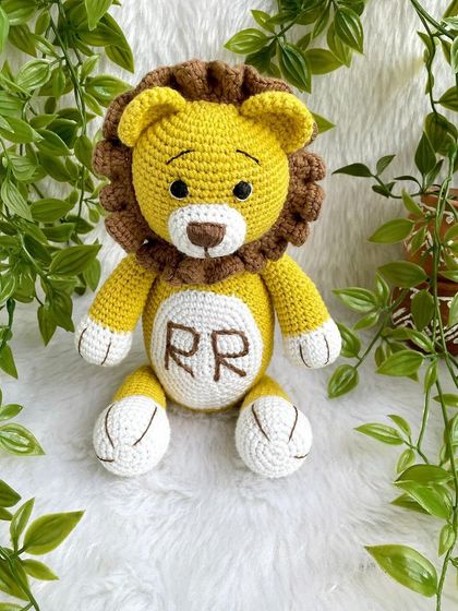 A royal lion plushie, personalized with the initials "RR" on his belly. This majestic friend is ready to rule the playroom with kindness.