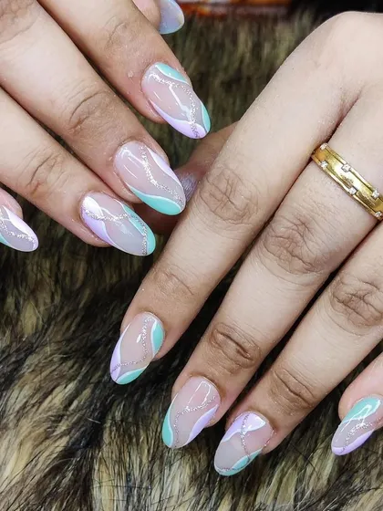 A dreamy pastel swirl design in mint green and lavender with a hint of silver glitter.