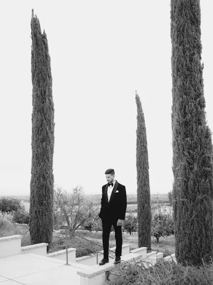 An editorial portrait of the groom, framed by the striking landscape of San Joaquin Valley, California. My approach to groom photography is modern and sophisticated, creating images with a strong, classic feel.