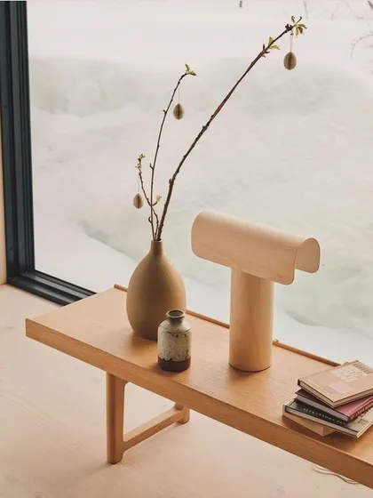 The Teelo table lamp by Secto Design, with its simple, architectural form. Made from PEFC-certified birch, it is a beautiful example of sustainable and minimalist Finnish design.