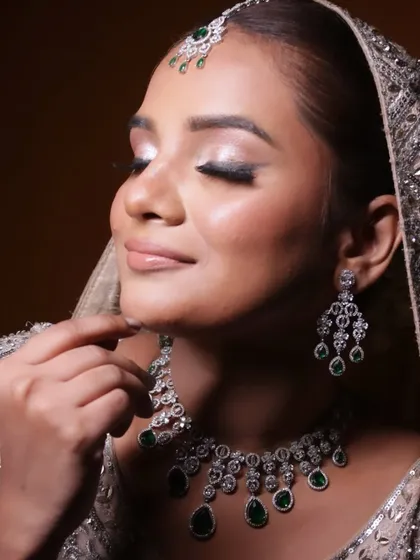 Eyes closed to showcase the beautiful silver shimmer on the eyelids, a simple yet impactful technique for modern brides.