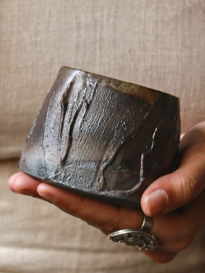 This saggar-fired piece, held in my hand, shows the smoky gradients and landscapes that can emerge from an electric kiln. It was a journey of learning and experimentation that reshaped the boundaries of my practice.