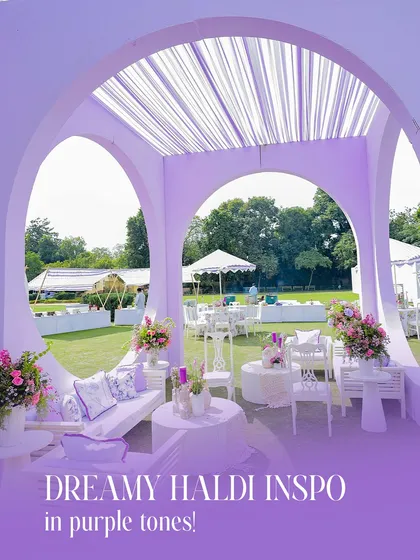 A cozy and stylish lounge area within the lavender-themed Haldi setup. The arched structure and all-white furniture create a sophisticated and intimate space for guests to relax.