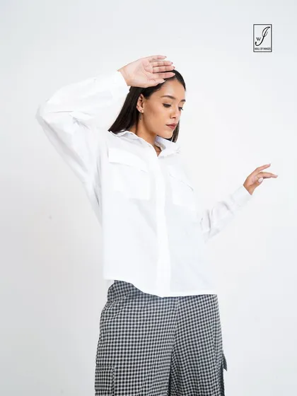 A dynamic pose that adds personality while still clearly displaying the clothing items.