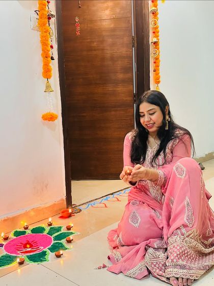 Lighting diyas and creating a colorful rangoli at the entrance of my home. These small traditional details bring so much warmth and festive spirit to the space during Diwali.