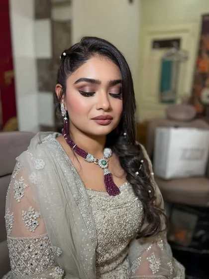 A soft and glowing look with shimmery eyes and a mauve lip, perfect for a party.