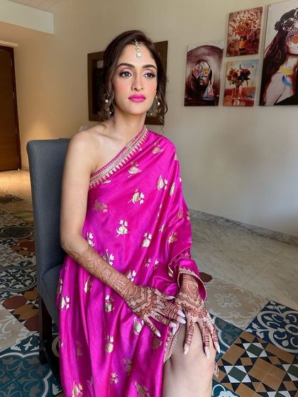 The final look for Deepali's Haldi. The minimal eye makeup, bold lip, and elegant hairstyle come together to create a look that is both modern and timeless.