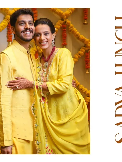 A portrait from the 'Sadya Lunch' event in Kochi. The couple, dressed in vibrant yellow, perfectly complements the festive and traditional theme of the South Indian feast.