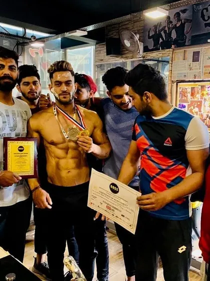 The whole team celebrating a client's victory. When you train with me, you join a community of winners who support and push each other to be their best.