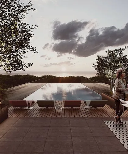 The rooftop pool and bar at the Alibaug clubhouse offer an infinity edge view towards the sea. This elevated social space is the pinnacle of the community's amenities, designed for relaxation and entertainment against a stunning natural backdrop.