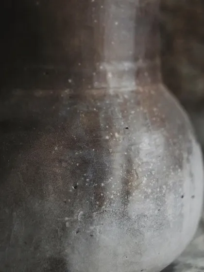 I call this pit-fired vase 'Stardust'. I achieved this subtle, speckled effect by throwing sawdust onto the piece when it was still hot from the fire. It’s a beautiful, earthy piece for dry arrangements.