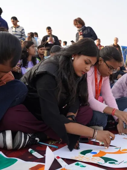 Students deeply focused on their artwork during our public art event at Central Park, Connaught Place. This event was a great platform for them to showcase their talent to a wider audience.