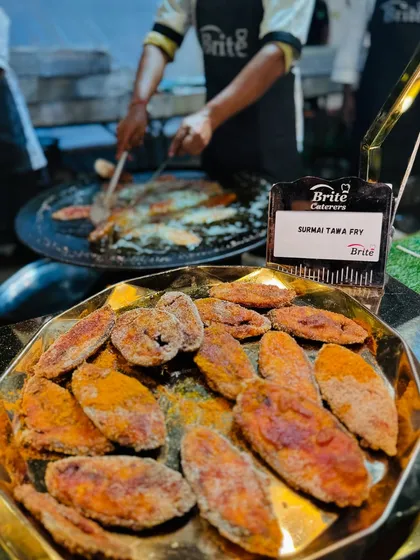 A tempting close-up of the crispy, masala-coated Surmai Tawa Fry, a favorite among seafood lovers.