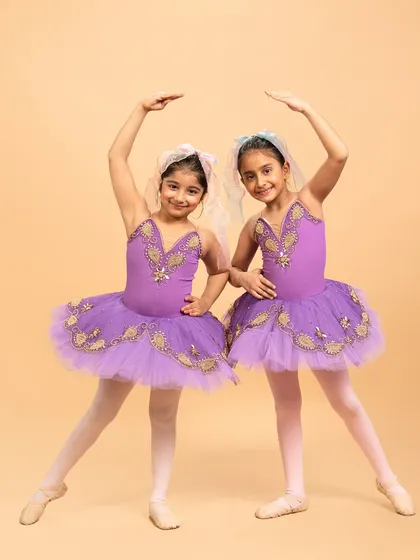 Our little ballerinas posing for their performance of 'Coppélia Reimagined.' Their doll like elegance and static poses are central to this whimsical and charming ballet piece.