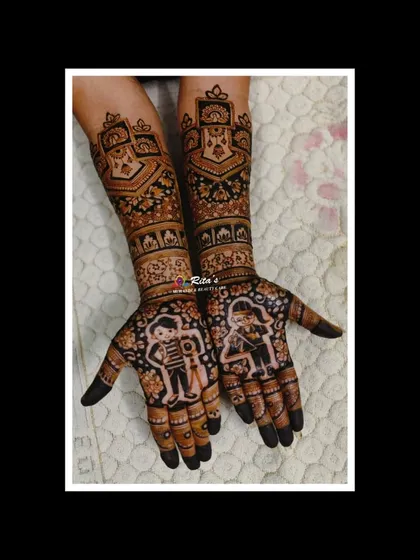 A unique engagement mehendi customized to the couple's professions. One hand depicts a photographer, and the other an electronics engineer, telling their modern love story.