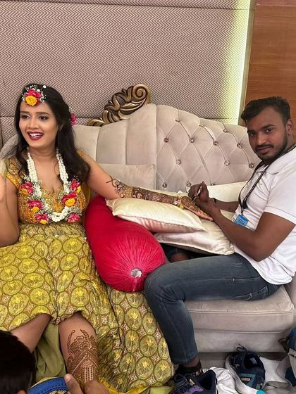 Me with a happy bride during her mehndi ceremony. It's a joy to be part of such a special day and create art that makes the bride smile.