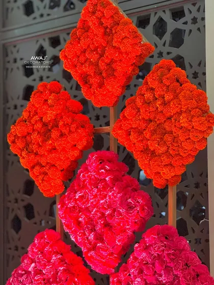 A close-up of the marigold art, showing the texture and vibrant color of the flower panels.