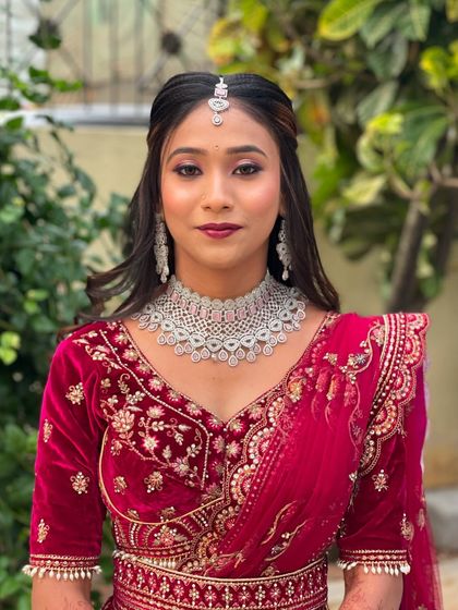 A direct portrait of Pallavi, showing her complete reception look. The makeup is bold yet balanced, perfect for a bride.