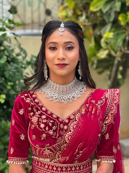 A simple and elegant portrait showcasing the makeup and diamond jewellery.