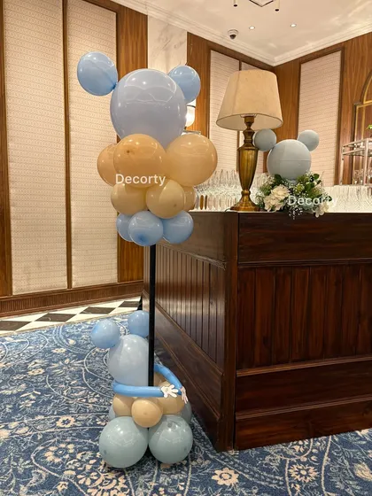 The stylish Mickey Mouse balloon sculptures add a modern and fun touch to the party's decor.