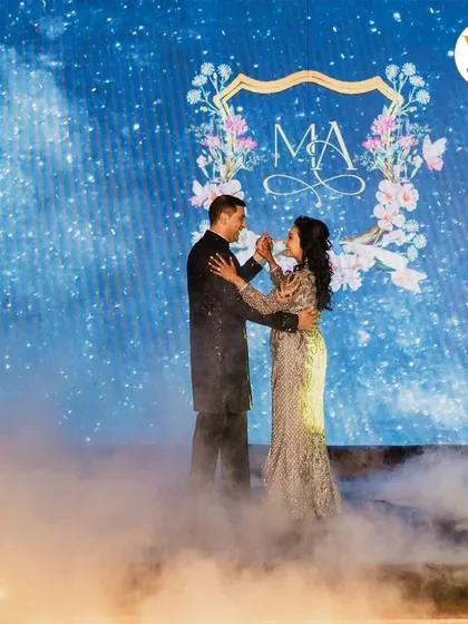 We bring your unique vision to life with thematic decor. For this celestial-themed Sangeet, the couple shared their first dance amidst swirling fog and a starry backdrop, creating a moment that felt like it was straight out of a fairytale.