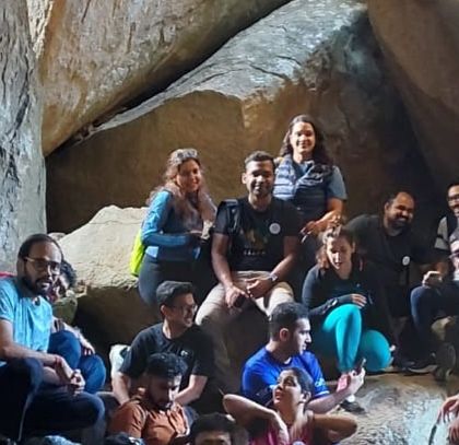 A group takes a break inside one of the larger chambers of the Anthargange caves.