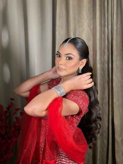 Komal looking stunning in her red engagement outfit. The makeup is soft and pretty, letting her natural beauty shine.