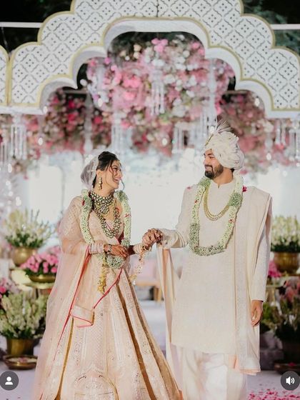 A beautiful wedding moment. The bride's hair is styled in a soft half updo, which works perfectly under her veil.