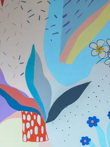 A close-up of the happy and fun custom artwork on the wall. The abstract shapes and bright colors create a playful and artistic vibe.