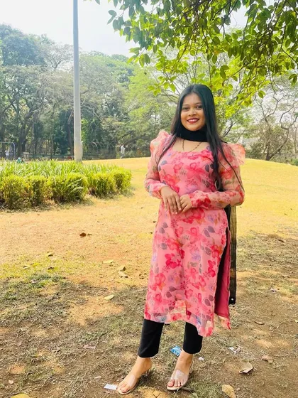 Another lovely photo of the client in her floral kurta. The bright colors and lightweight fabric make it a perfect choice for daytime events.