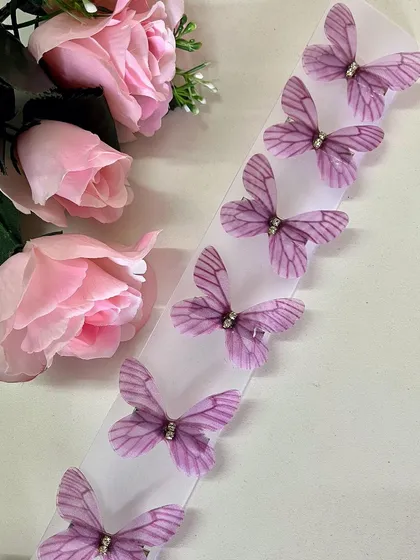 The rich purple of these fabric butterflies adds a touch of royalty and elegance.