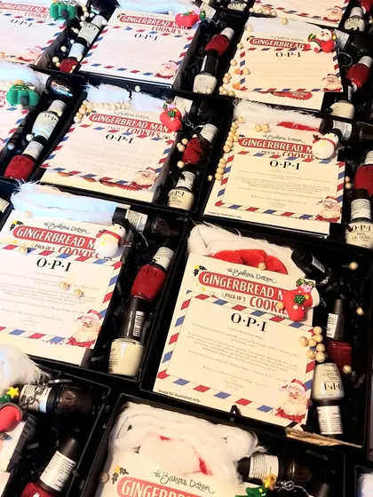 Another angle of the OPI India Christmas hampers, showing the detailed layout and personalized recipe cards we included to make the gift interactive and fun.