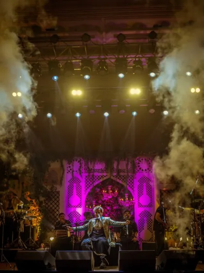 A dramatic entrance with smoke effects at the ITC Royal Bengal, setting the tone for an epic night.