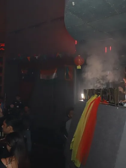 A wide shot of the DJ booth at Mansion, with smoke effects adding to the intense atmosphere of the club.