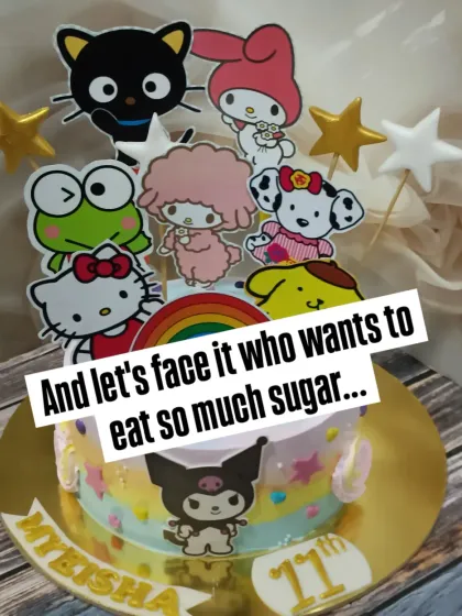 A vibrant Sanrio-themed cake featuring Hello Kitty, Kuromi, and friends. Using non-edible cutouts allows for a clean, colorful design that kids love.
