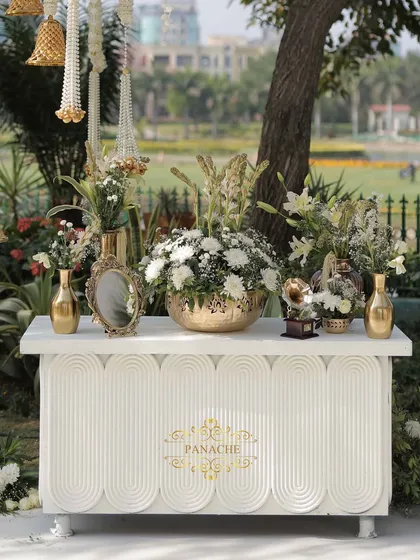 A frontal view of the elegant welcome console, branded with our Panache logo.
