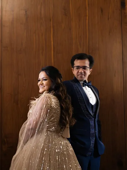 A poised and elegant portrait of the couple. Her soft glam makeup is the perfect complement to his classic tuxedo.