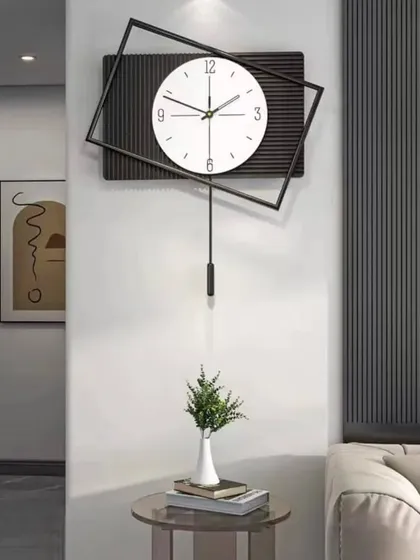 With its tilted square frame and pendulum, this clock offers a dynamic and modern aesthetic. The clean lines and simple color palette make it a sophisticated choice for a minimalist or contemporary interior.