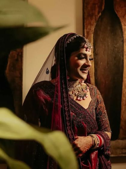 A candid, happy moment of the bride during her getting ready session. Her natural smile shows her excitement for the day ahead.